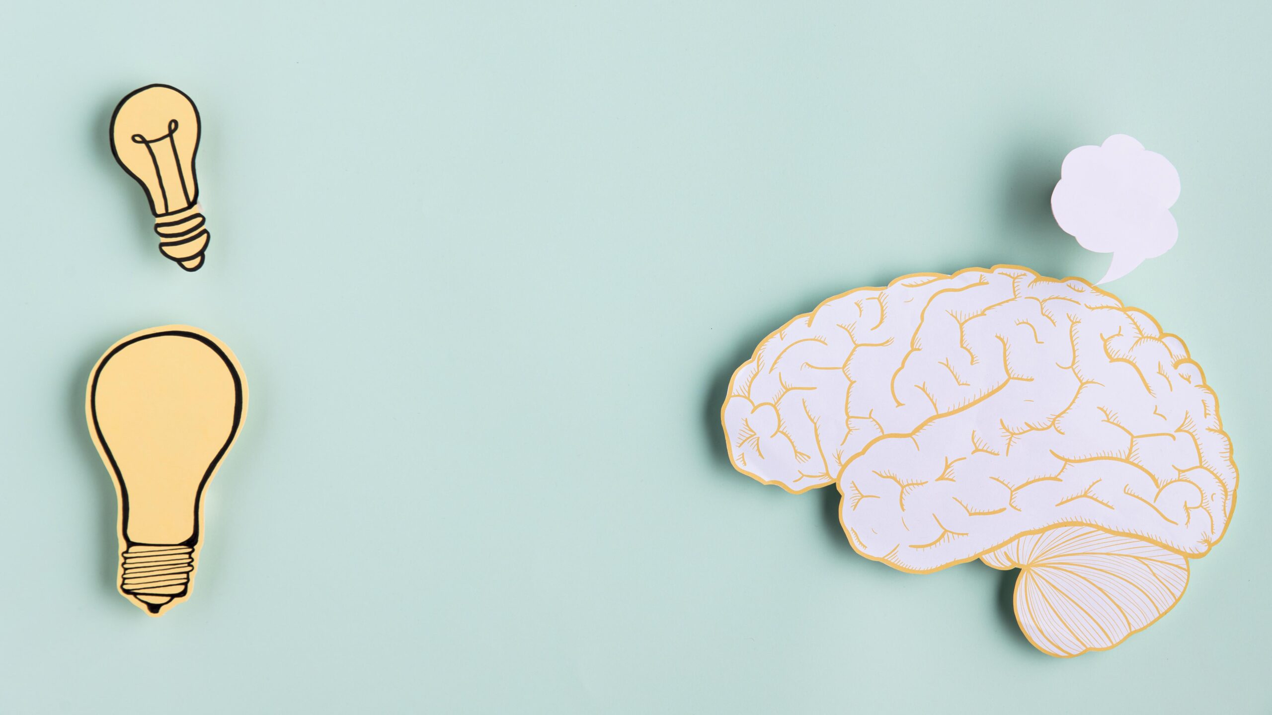 Creative visualization of the human brain next to a lightbulb representing mental clarity and ideas